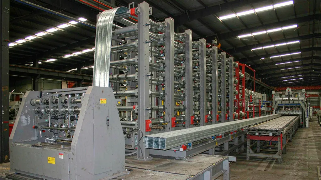 Cold-formed steel roll forming line producing galvanised C-channel purlins in a factory