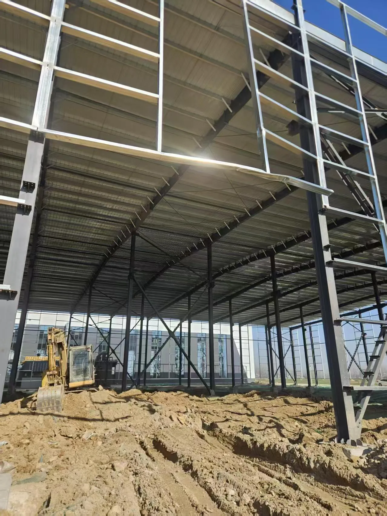 Sydney warehouse construction site - crane lifting steel beams